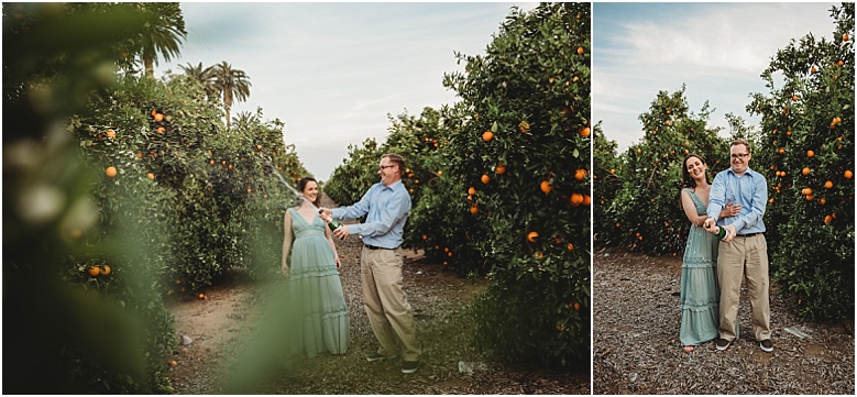couple popping champagne in orange groves at California Citrus State Historic Park in Riverside, CA by Dallas Wedding Photographer for their engagement session 