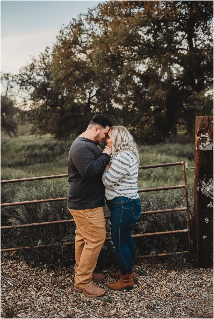 couple at Owl Creek Farms Foundation a Temecula wedding venue for their engagement session during sunset