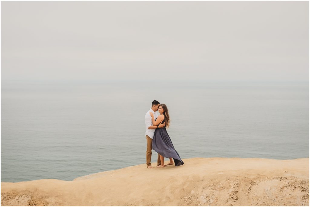 Intimate San Diego beach engagement session at Blacks Beach in La Jolla, CA by Dallas Wedding Photographer