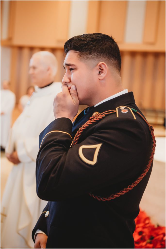 military groom during ceremony at St. John Vianney Catholic church