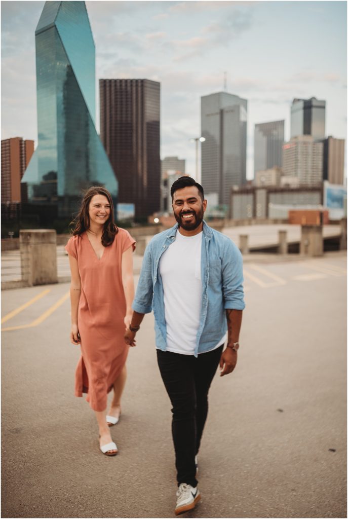 couple overlooking Dallas, Texas skyline by Dallas wedding photographer